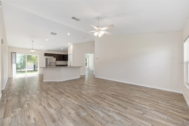 5425 Pecan Rd, Ocala, FL 34472 - unfurnished living room featuring lofted ceiling, a ceiling fan, light wood-style flooring, baseboards, and recessed lighting