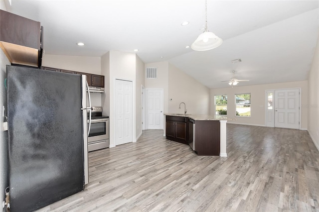 5425 Pecan Rd, Ocala, FL 34472 - kitchen with appliances with stainless steel finishes, a sink, dark brown cabinetry, ceiling fan, and open floor plan