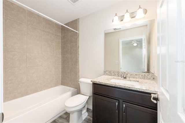 5425 Pecan Rd, Ocala, FL 34472 - full bathroom featuring toilet, vanity, shower / washtub combination, and wood finished floors