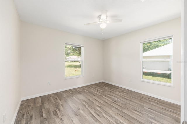5425 Pecan Rd, Ocala, FL 34472 - empty room featuring wood finished floors, ceiling fan, and baseboards