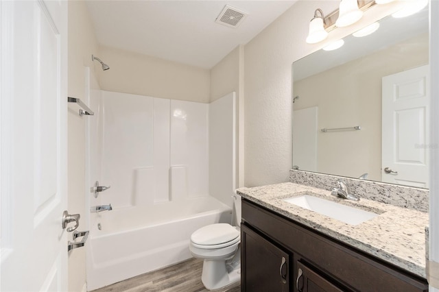 5425 Pecan Rd, Ocala, FL 34472 - bathroom with vanity, toilet, wood finished floors, and washtub / shower combination