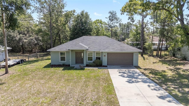 5425 Pecan Rd, Ocala, FL 34472 - view of front of house featuring a garage, driveway, stucco siding, and view of wooded area