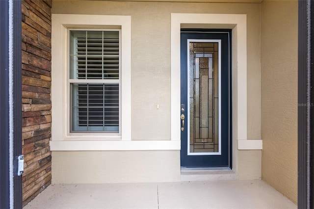 9777 SW 63rd Loop, Ocala, FL 34481 - property entrance with stucco siding