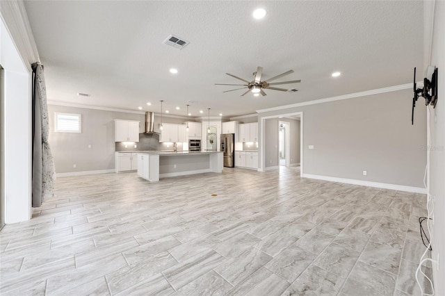 9777 SW 63rd Loop, Ocala, FL 34481 - unfurnished living room with crown molding, ceiling fan, recessed lighting, baseboards, and a textured ceiling