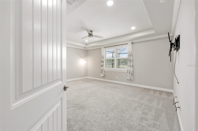 9777 SW 63rd Loop, Ocala, FL 34481 - carpeted empty room featuring a tray ceiling, ceiling fan, baseboards, recessed lighting, and a textured ceiling