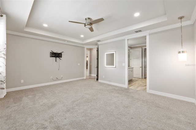 9777 SW 63rd Loop, Ocala, FL 34481 - unfurnished bedroom featuring a tray ceiling, light colored carpet, baseboards, and recessed lighting
