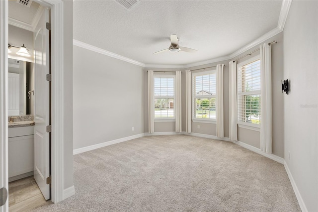 9777 SW 63rd Loop, Ocala, FL 34481 - unfurnished bedroom featuring crown molding, light carpet, baseboards, a textured ceiling, and ceiling fan