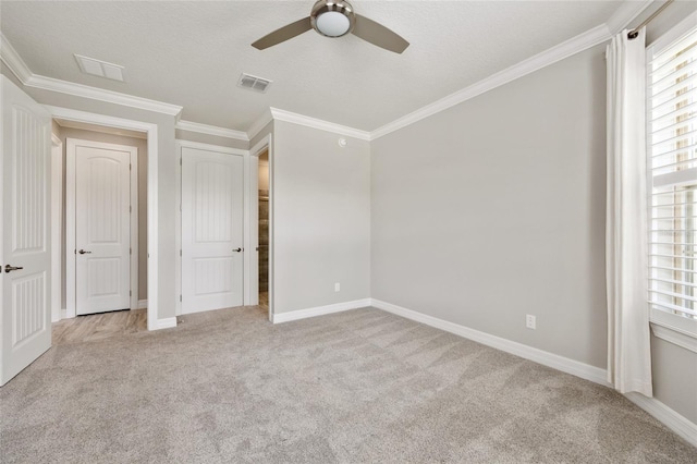 9777 SW 63rd Loop, Ocala, FL 34481 - unfurnished bedroom with light carpet, multiple windows, crown molding, and baseboards