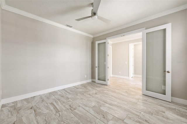 9777 SW 63rd Loop, Ocala, FL 34481 - empty room featuring french doors, a ceiling fan, ornamental molding, a textured ceiling, and baseboards