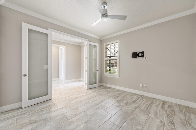 9777 SW 63rd Loop, Ocala, FL 34481 - unfurnished room featuring french doors, crown molding, a ceiling fan, a textured ceiling, and baseboards