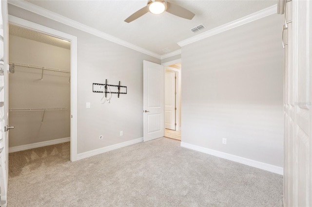 9777 SW 63rd Loop, Ocala, FL 34481 - unfurnished bedroom with carpet, ornamental molding, a walk in closet, baseboards, and a closet
