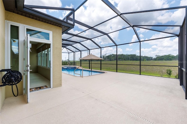 9777 SW 63rd Loop, Ocala, FL 34481 - view of pool featuring a patio area, glass enclosure, and a pool with connected hot tub