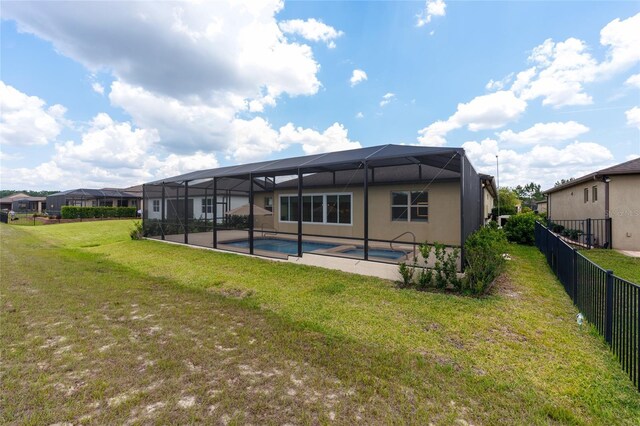 9777 SW 63rd Loop, Ocala, FL 34481 - back of property with glass enclosure and a patio