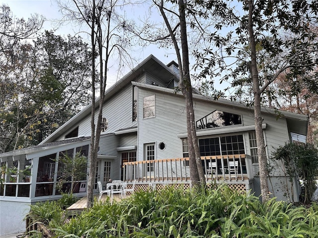 4305 SW 20th Ave, Ocala, FL 34471 - back of property with a sunroom and a deck