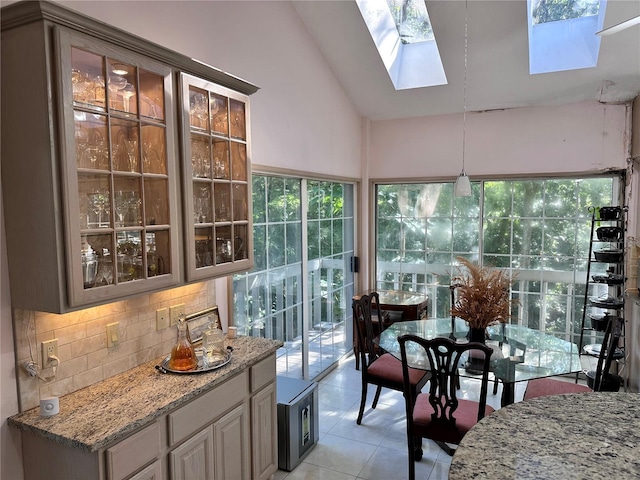 4305 SW 20th Ave, Ocala, FL 34471 - sunroom / solarium featuring a skylight, tile patterned flooring, plenty of natural light, and high vaulted ceiling