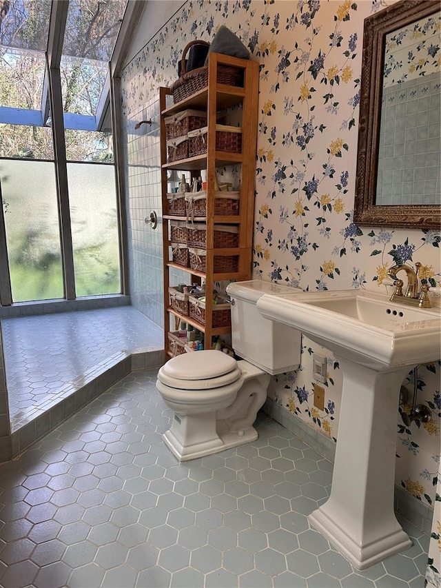 4305 SW 20th Ave, Ocala, FL 34471 - bathroom featuring wallpapered walls, toilet, tile patterned flooring, and baseboards