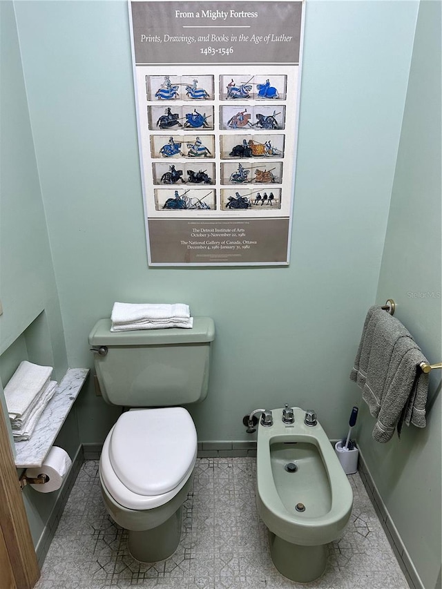 4305 SW 20th Ave, Ocala, FL 34471 - bathroom with baseboards, a bidet, and toilet