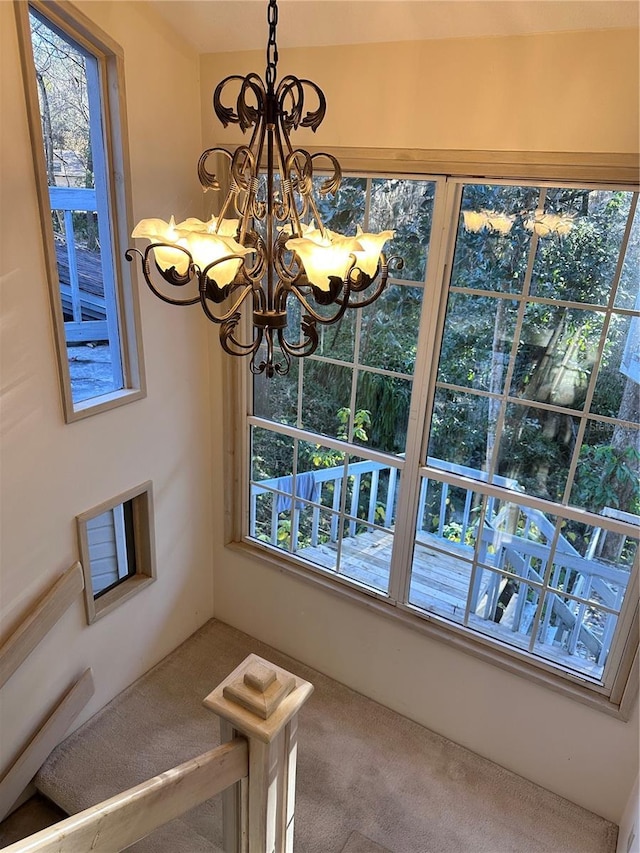 4305 SW 20th Ave, Ocala, FL 34471 - unfurnished dining area with carpet flooring and a chandelier