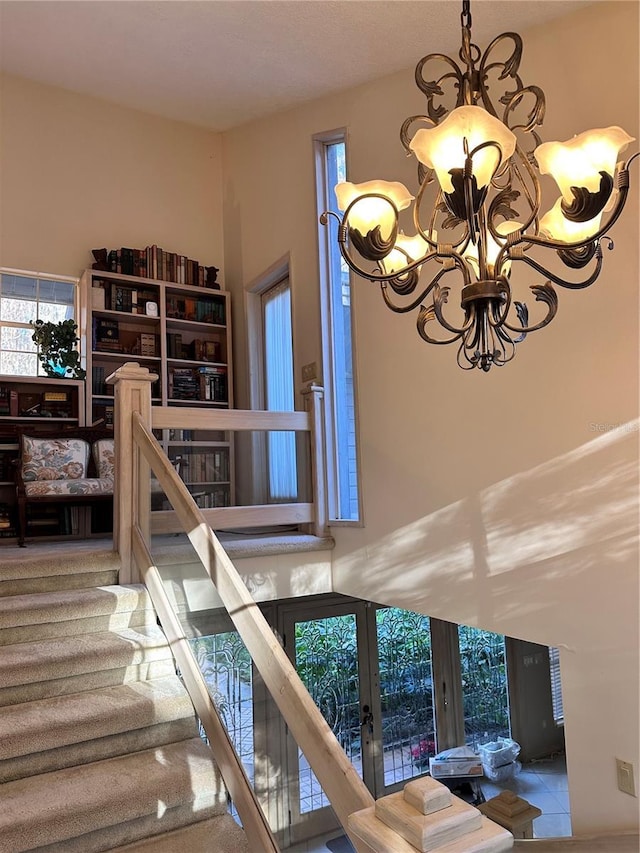 4305 SW 20th Ave, Ocala, FL 34471 - staircase with a chandelier and french doors