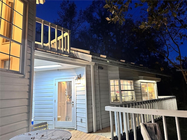 4305 SW 20th Ave, Ocala, FL 34471 - exterior entry at night featuring a deck and a balcony