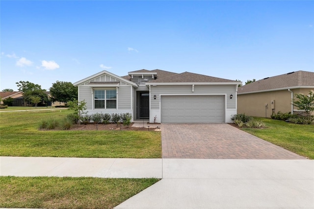 4892 NW 39th Loop, Ocala, FL 34482 - ranch-style house featuring decorative driveway, a garage, and a front yard