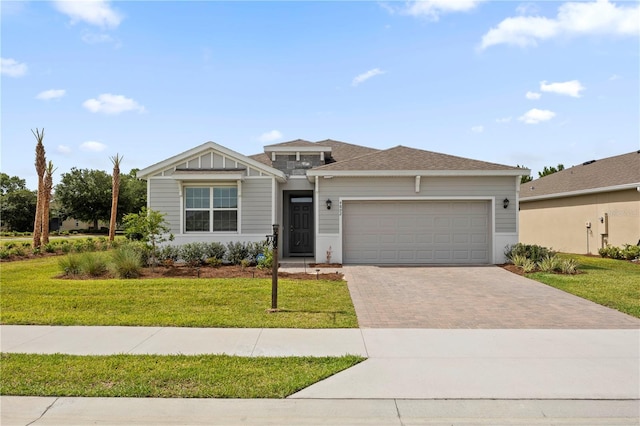 4892 NW 39th Loop, Ocala, FL 34482 - view of front of house featuring driveway, an attached garage, and a front lawn
