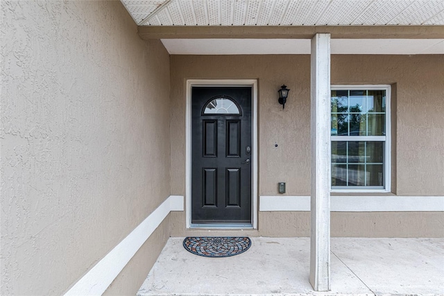 2690 SW 154th Ln, Ocala, FL 34473 - view of exterior entry with stucco siding