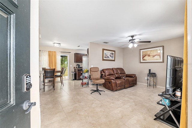2690 SW 154th Ln, Ocala, FL 34473 - living area featuring a ceiling fan and light tile patterned floors