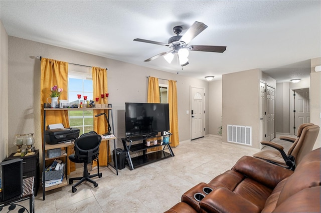 2690 SW 154th Ln, Ocala, FL 34473 - living room with a ceiling fan, light tile patterned floors, baseboards, and an office area