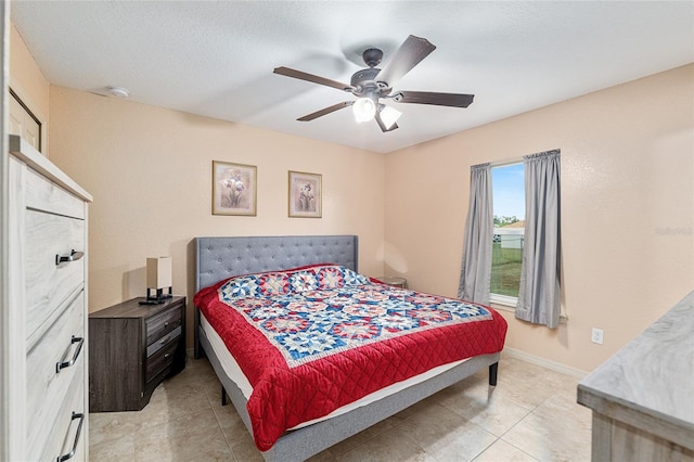 2690 SW 154th Ln, Ocala, FL 34473 - bedroom featuring light tile patterned floors, ceiling fan, and baseboards