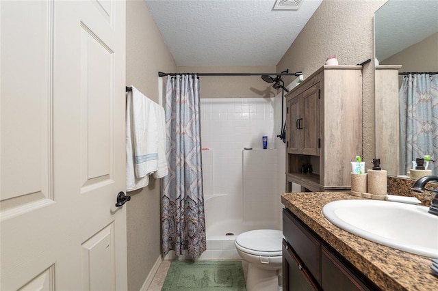 2690 SW 154th Ln, Ocala, FL 34473 - full bath featuring vanity, a textured ceiling, a tile shower, toilet, and tile patterned floors