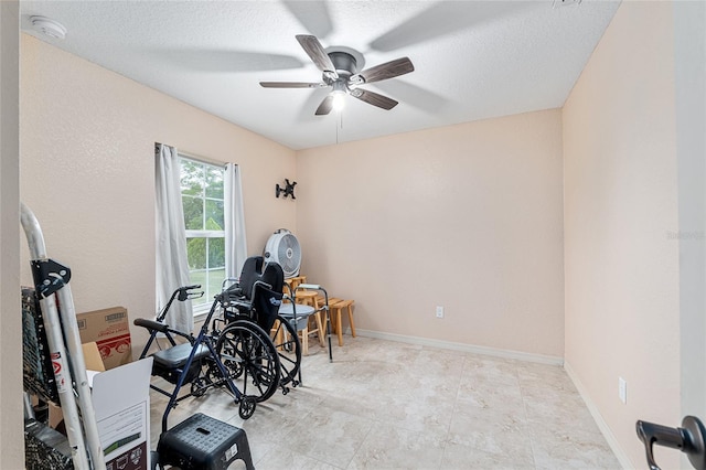 2690 SW 154th Ln, Ocala, FL 34473 - workout area with ceiling fan and a textured ceiling
