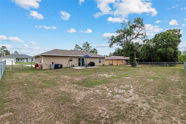 2690 SW 154th Ln, Ocala, FL 34473 - back of property featuring a patio area and stucco siding
