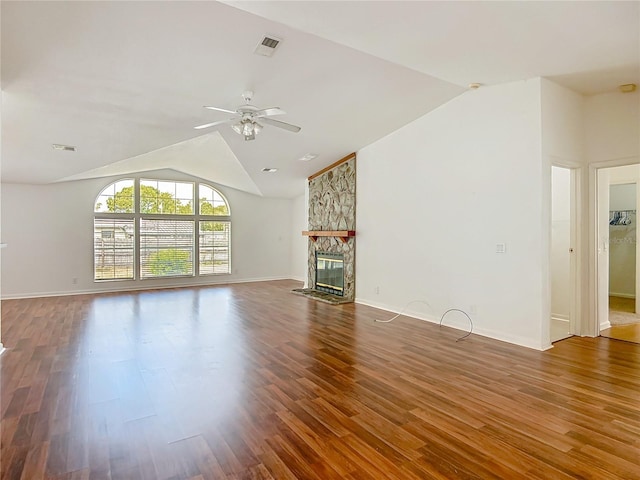12352 SE 86th Ct, Belleview, FL 34420 - unfurnished living room with vaulted ceiling, ceiling fan, wood finished floors, baseboards, and a fireplace