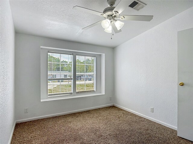 12352 SE 86th Ct, Belleview, FL 34420 - carpeted empty room with a ceiling fan, baseboards, a textured wall, and a textured ceiling