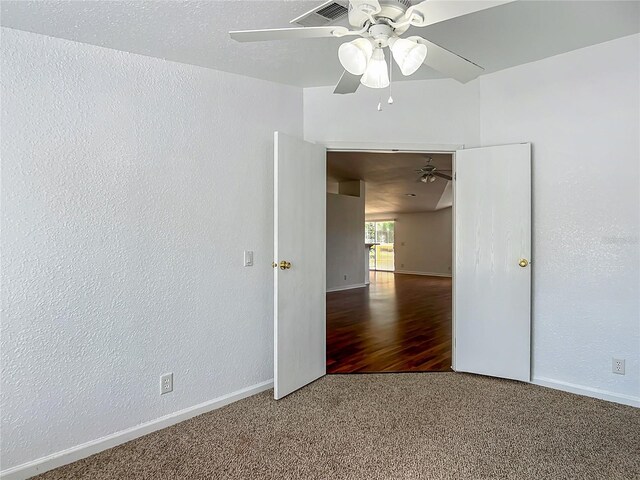 12352 SE 86th Ct, Belleview, FL 34420 - carpeted spare room with ceiling fan, baseboards, and a textured wall