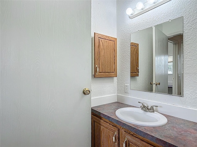 12352 SE 86th Ct, Belleview, FL 34420 - bathroom with vanity and a textured wall