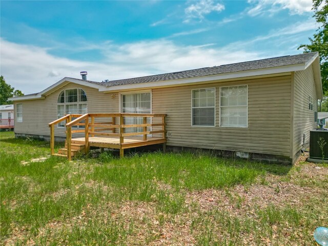 12352 SE 86th Ct, Belleview, FL 34420 - rear view of property featuring a wooden deck, central AC unit, and crawl space