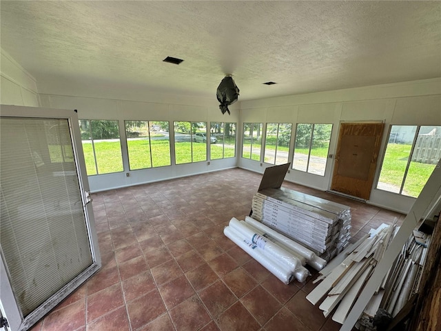 4000 SW 6th Ave, Ocala, FL 34471 - sunroom with healthy amount of natural light, a decorative wall, and a textured ceiling