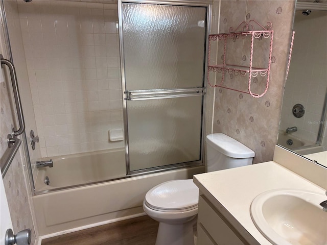 9801 SW 88th Ter Unit B, Ocala, FL 34481 - bathroom with toilet, enclosed tub / shower combo, vanity, and wood finished floors