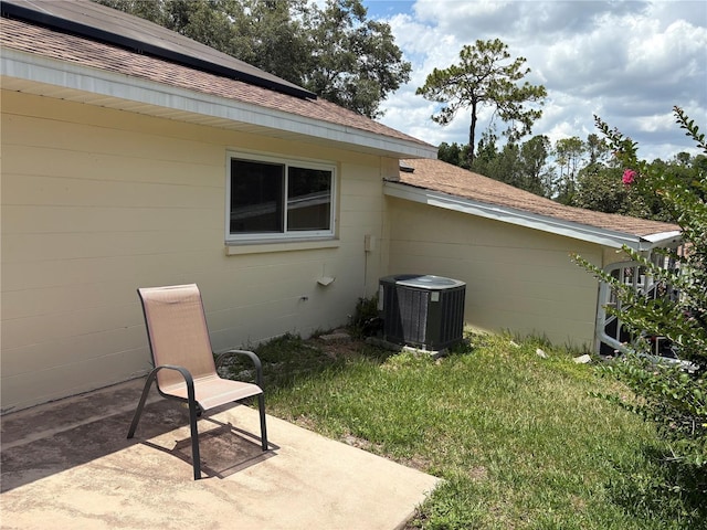 9801 SW 88th Ter Unit B, Ocala, FL 34481 - view of green lawn featuring cooling unit and a patio