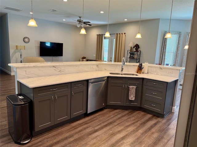 10208 SE 170th Pl, Summerfield, FL 34491 - kitchen featuring stainless steel dishwasher, a sink, gray cabinetry, dark wood-type flooring, and recessed lighting
