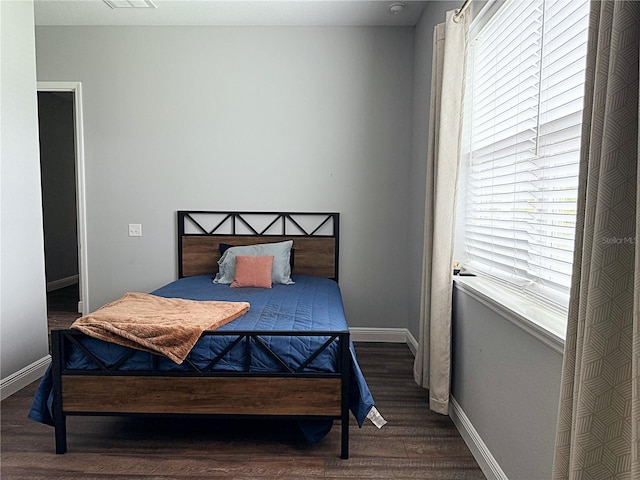 10208 SE 170th Pl, Summerfield, FL 34491 - bedroom featuring multiple windows, wood finished floors, and baseboards