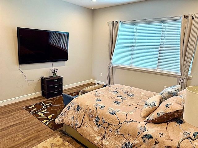 10208 SE 170th Pl, Summerfield, FL 34491 - bedroom featuring wood finished floors and baseboards
