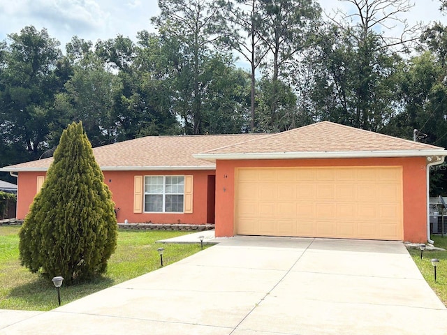 14 Dogwood Drive Radl, Ocala, FL 34472 - single story home with stucco siding, driveway, a garage, and a front yard