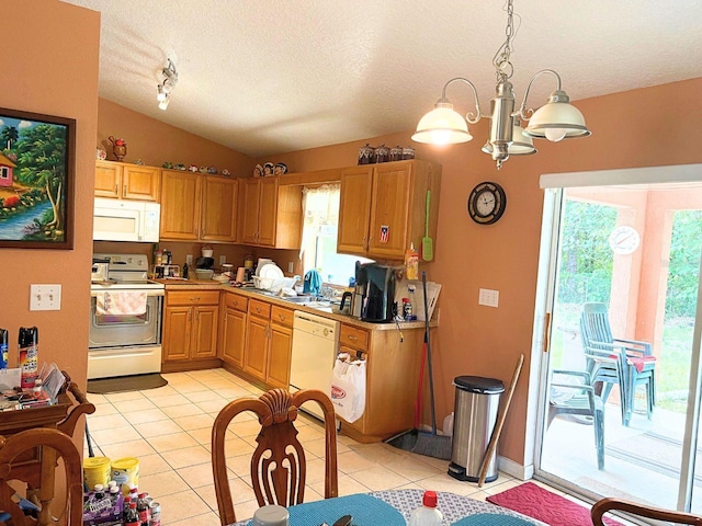 14 Dogwood Drive Radl, Ocala, FL 34472 - kitchen featuring white appliances, vaulted ceiling, a textured ceiling, light tile patterned flooring, and healthy amount of natural light