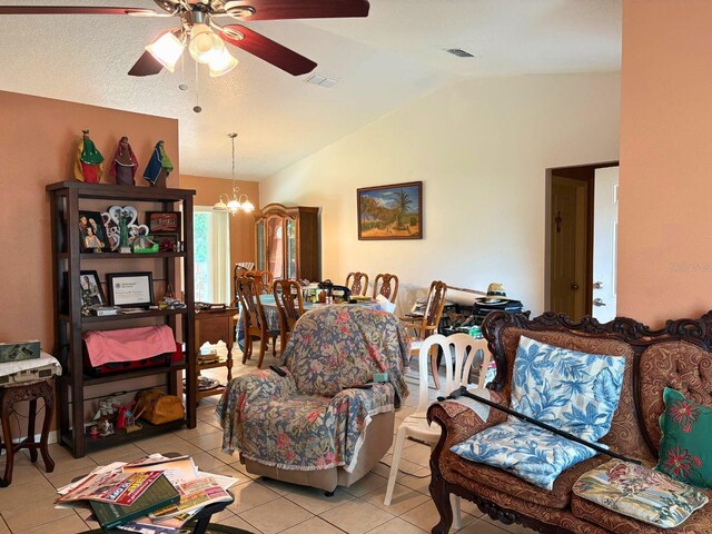 14 Dogwood Drive Radl, Ocala, FL 34472 - living room featuring vaulted ceiling, a ceiling fan, light tile patterned floors, and a chandelier