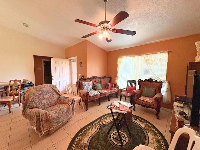 14 Dogwood Drive Radl, Ocala, FL 34472 - living room with vaulted ceiling, ceiling fan, light tile patterned floors, and a textured ceiling