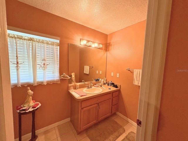 14 Dogwood Drive Radl, Ocala, FL 34472 - bathroom with a textured ceiling, tile patterned floors, vanity, and baseboards