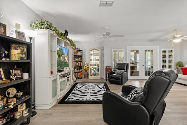 1631 W Dalary Pt Unit 1631, Crystal River, FL 34429 - living area featuring a ceiling fan, french doors, and light wood-style floors